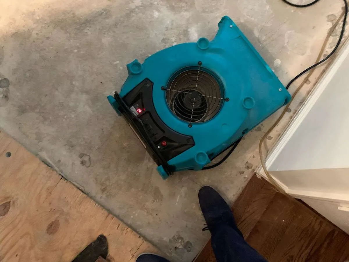 Air mover drying subfloor during Commercial Water Damage Restoration in Fort Myers Shores